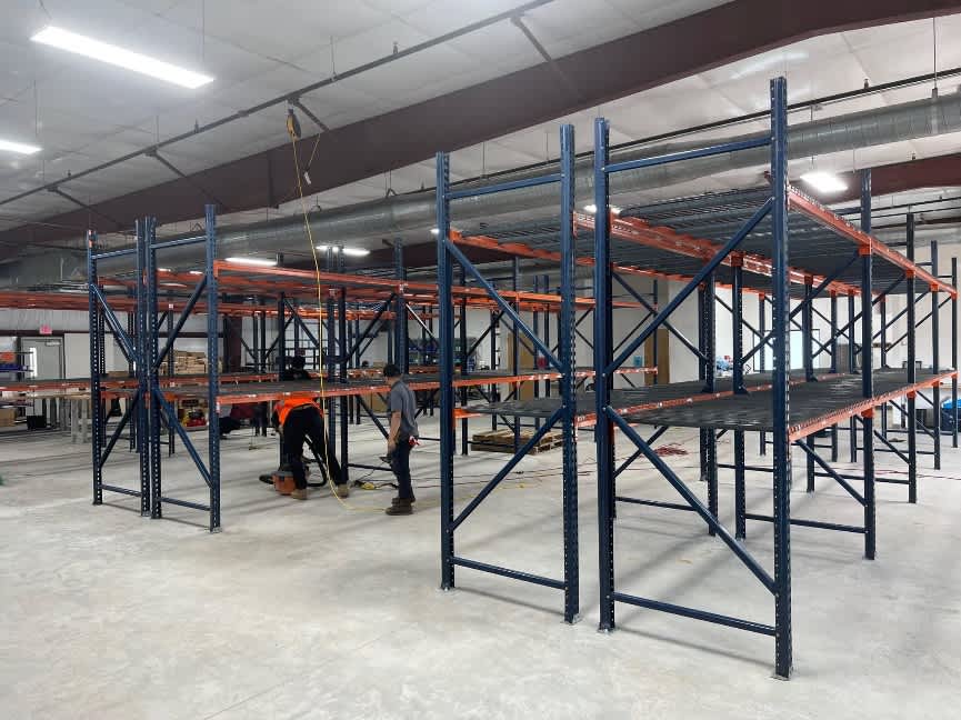Professional rack and shelving installation in an industrial warehouse